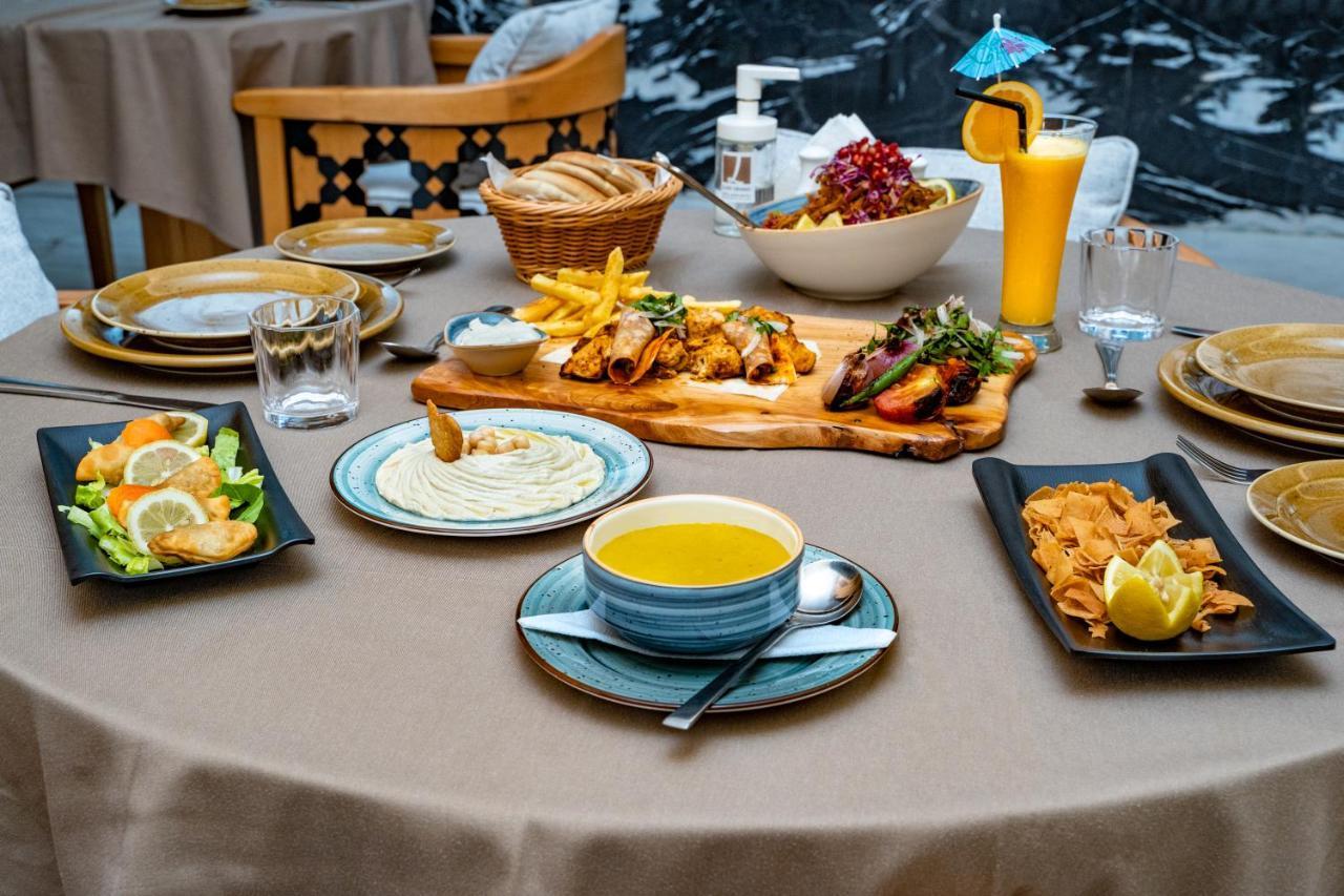 Luxe Grand Hotel Apartments Schardscha Exterior foto A selection of Turkish cuisine